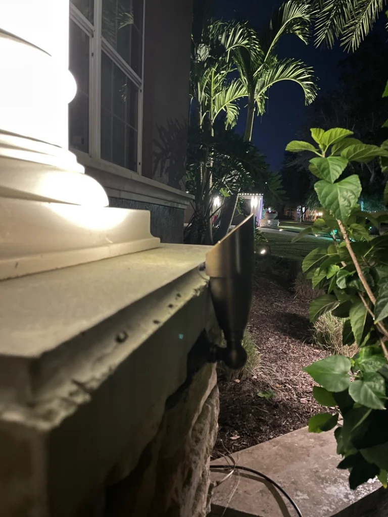 Properly placed outdoor wall lighting on a two-story home, showcasing even illumination and architectural details, designed by Southern Outdoor Lighting