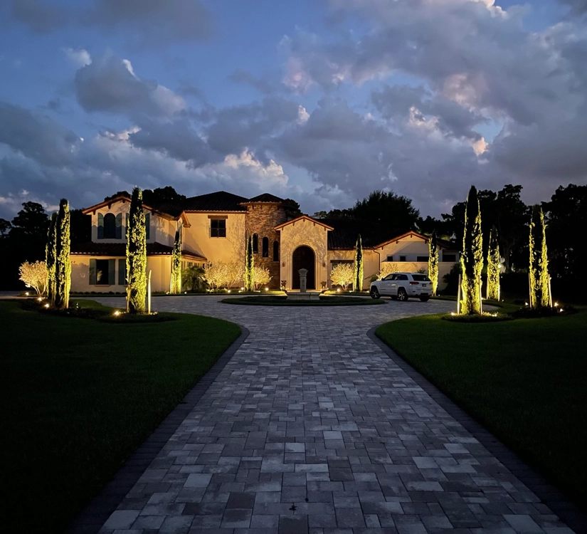 Outdoor wall lighting illuminating a home's front structure in Lake Wales, designed by Southern Outdoor Lighting to enhance safety and curb appeal.