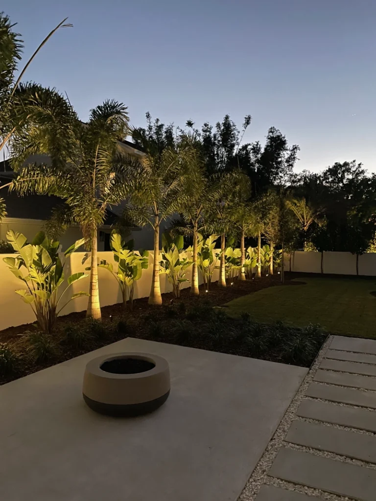 Outdoor wall lighting illuminating a Winter Garden property, creating ambiance and highlighting landscaping by Southern Outdoor Lighting